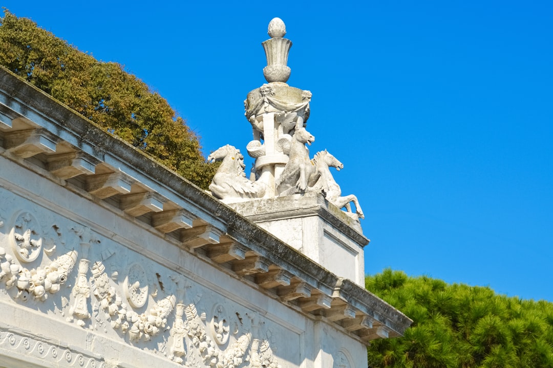 white concrete statue under blue sky during daytime