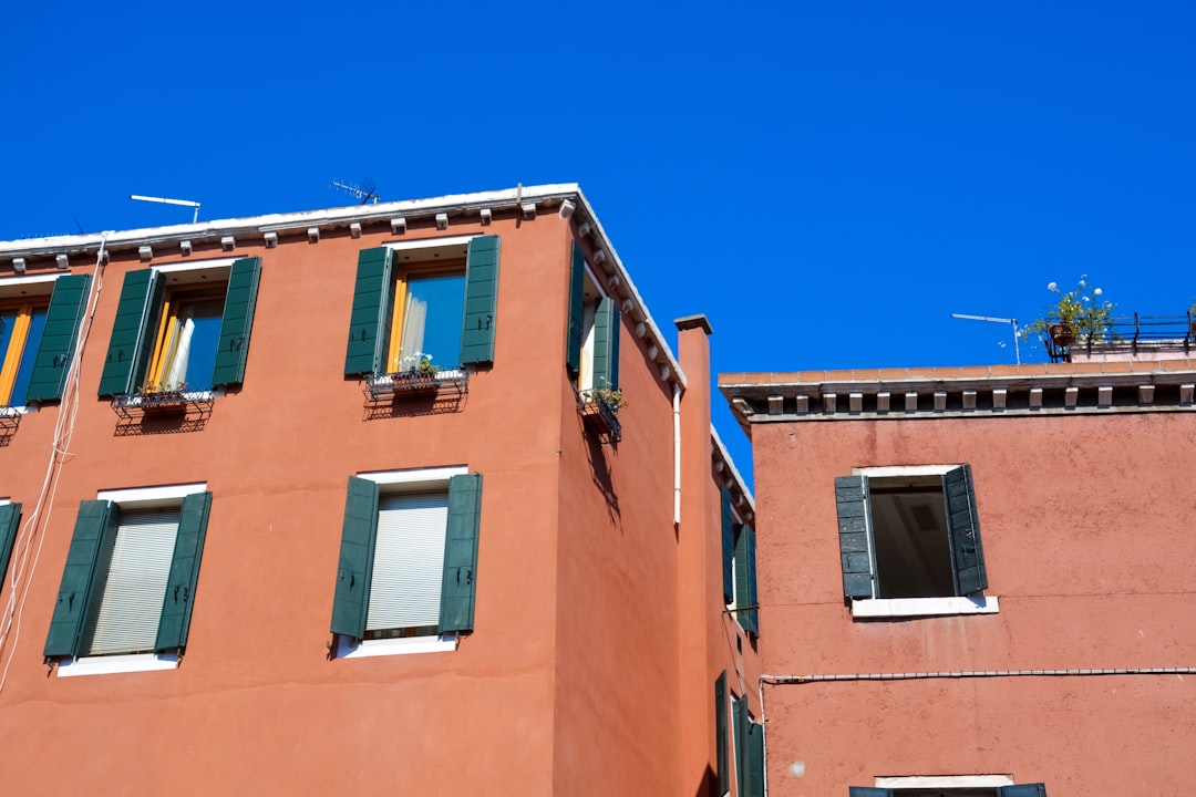 brown concrete building under blue sky during daytime