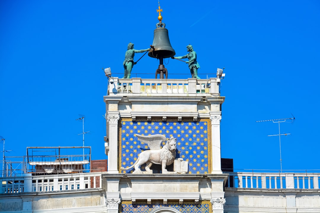 white concrete statue under blue sky during daytime