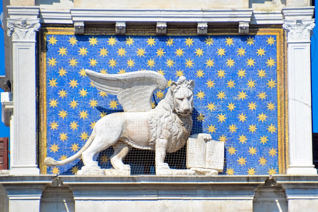white lion statue on yellow and blue wall