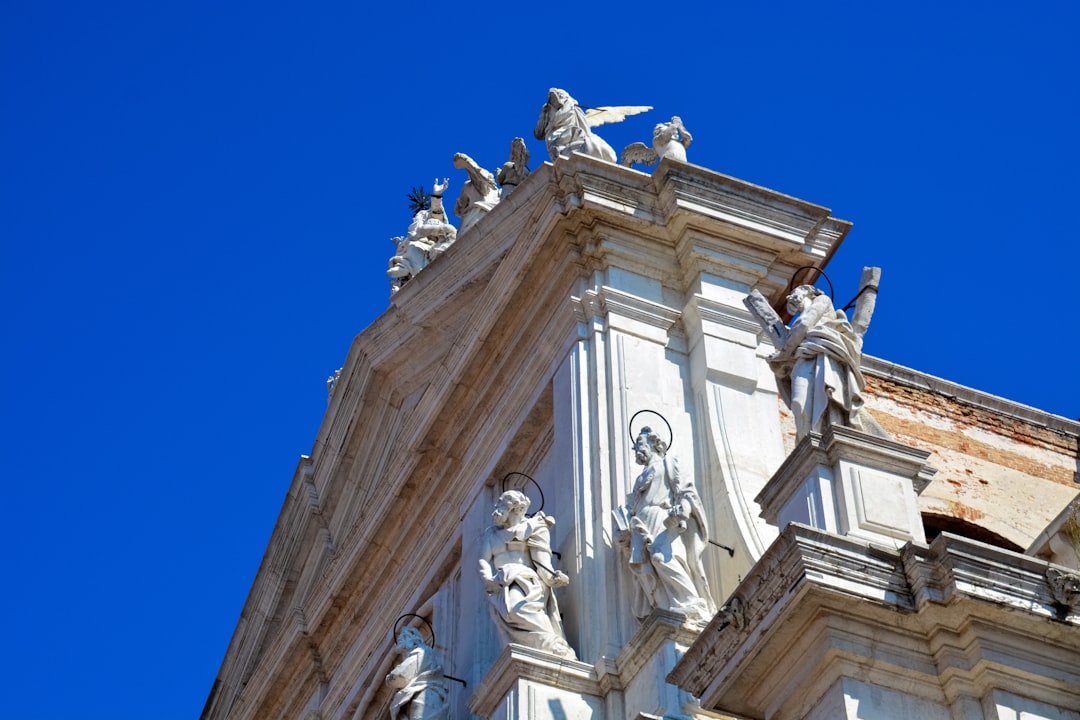 white concrete statue under blue sky during daytime