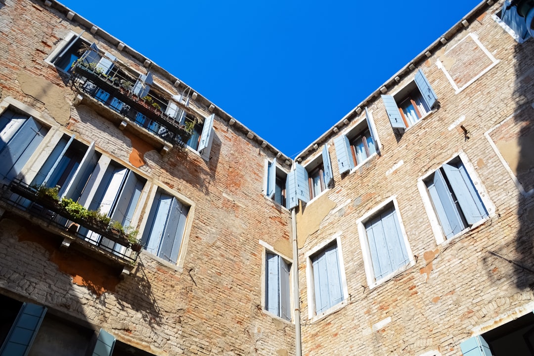 brown concrete building under blue sky during daytime