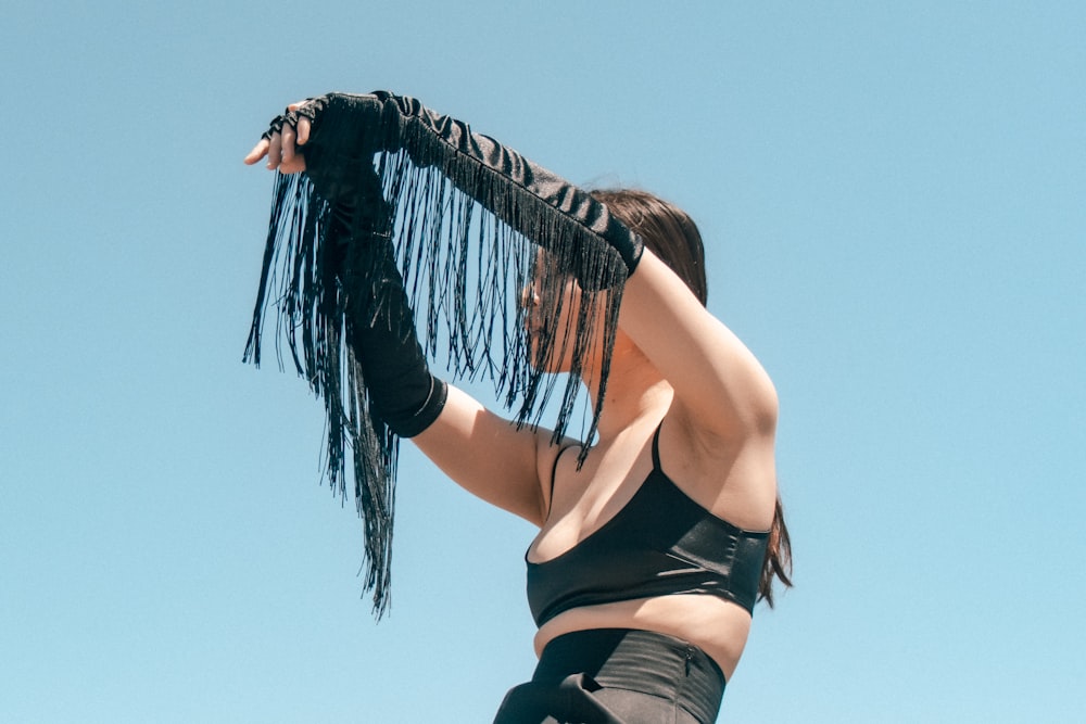 woman in black sports bra and black shorts