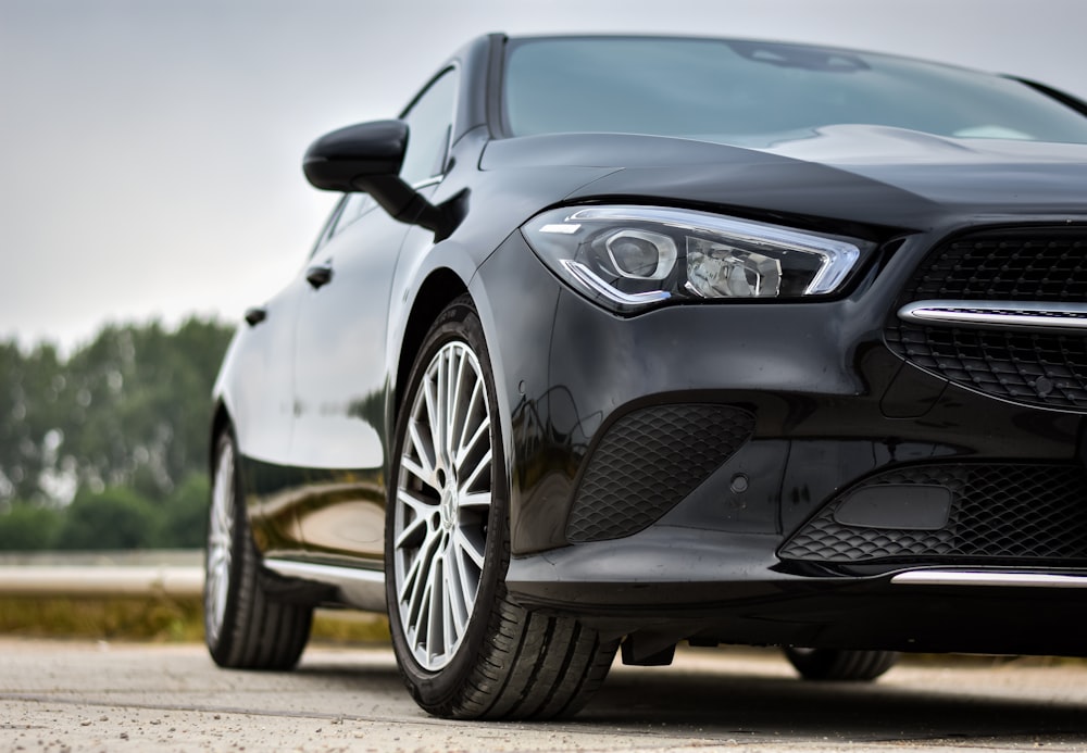 black mercedes benz coupe on road during daytime