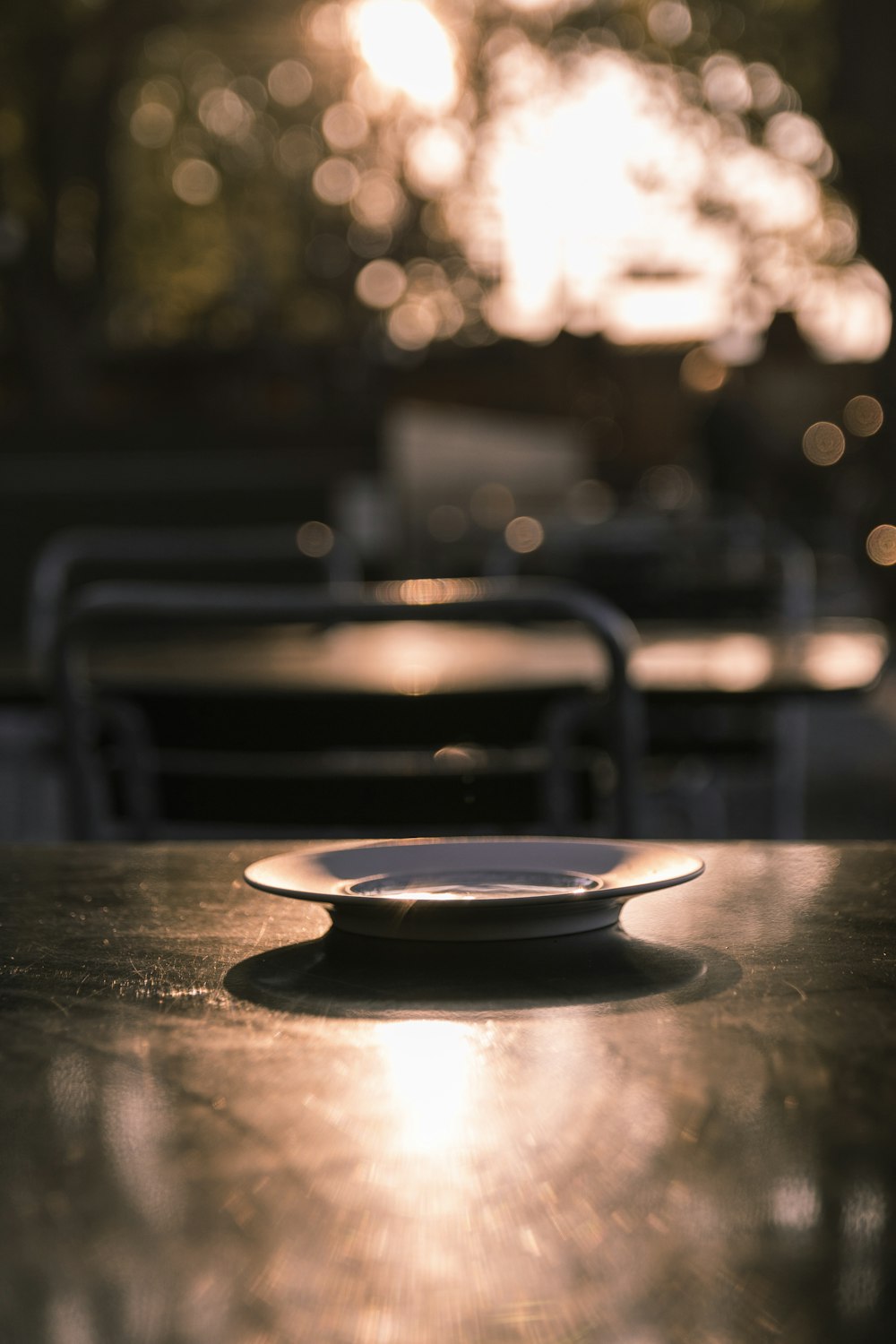 white ceramic plate on brown wooden table