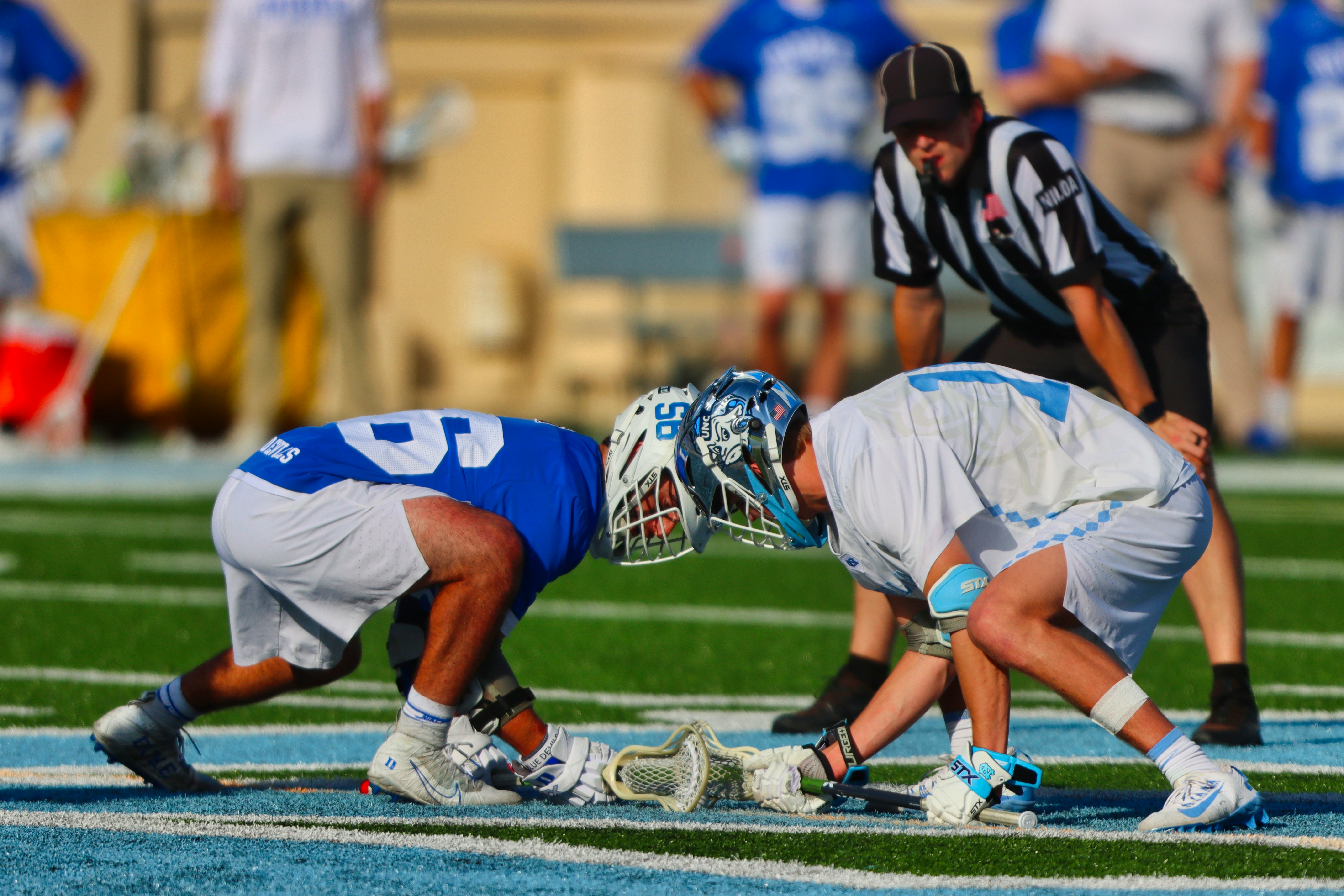 football players on field during daytime