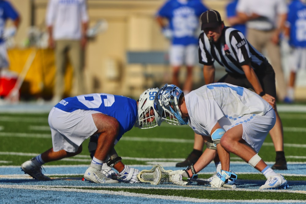 football players on field during daytime