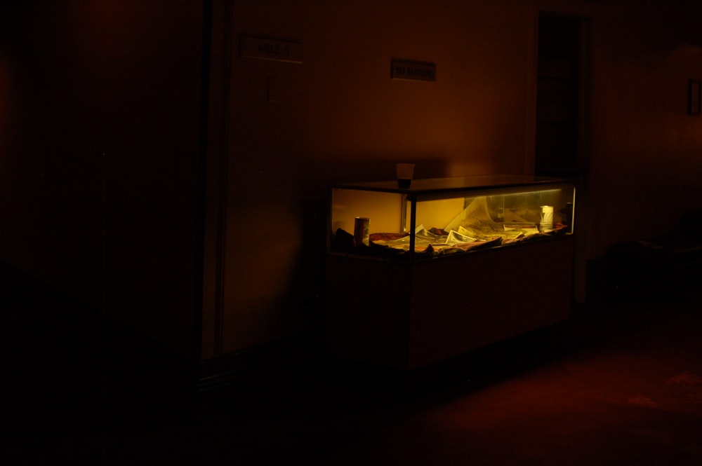 black framed fish tank on brown wooden table