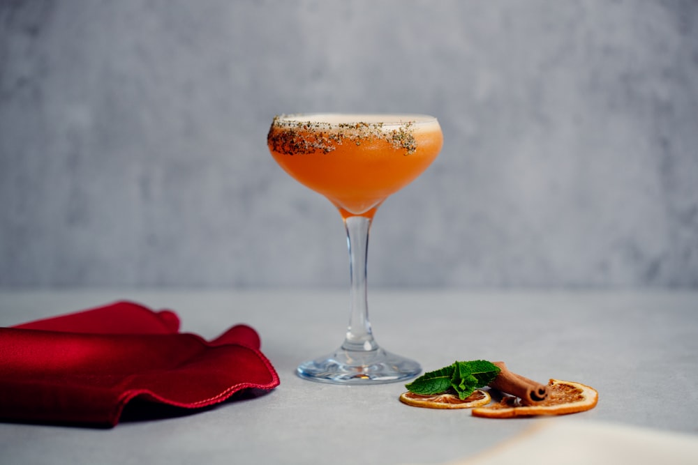 clear wine glass with orange liquid