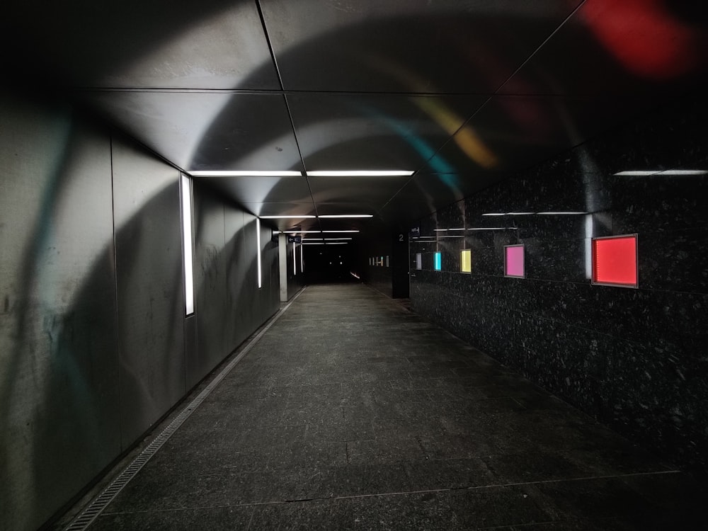 black and white tunnel with lights turned on during nighttime