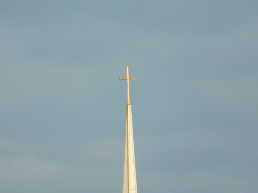 white and gold tower under blue sky