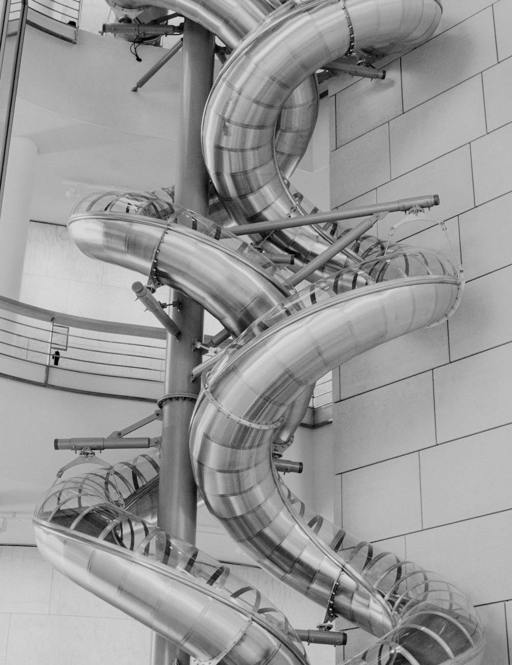 grayscale photo of spiral staircase