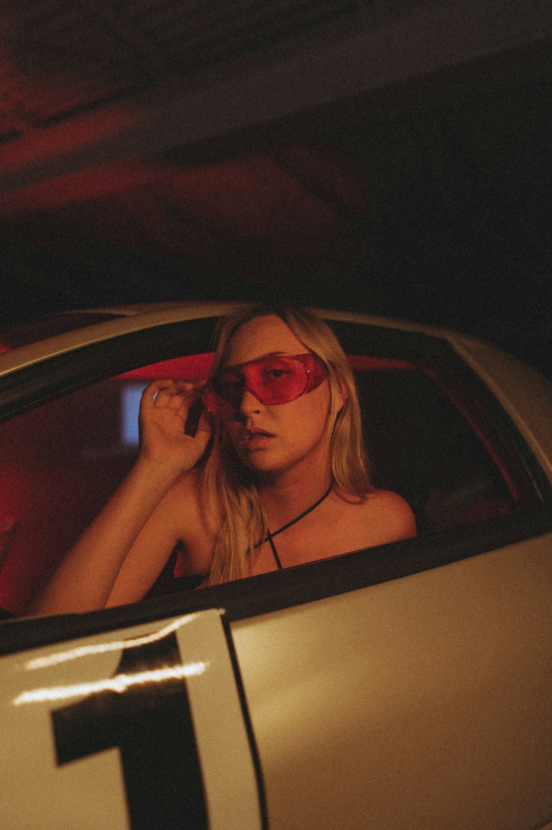 woman in black sunglasses inside car