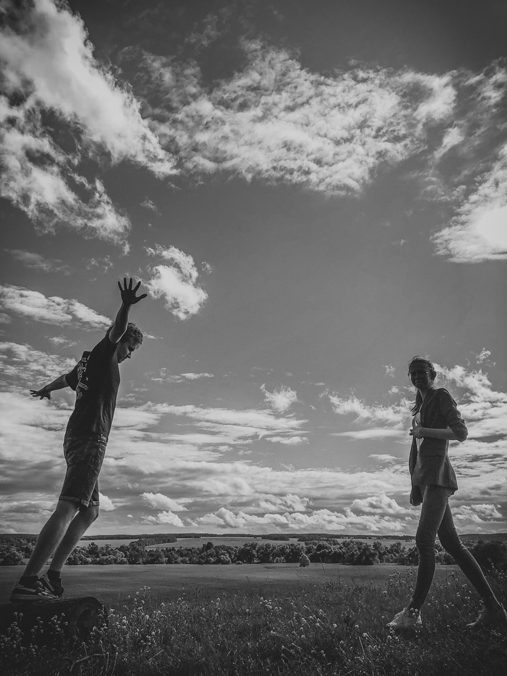 grayscale photo of 2 women walking on beach