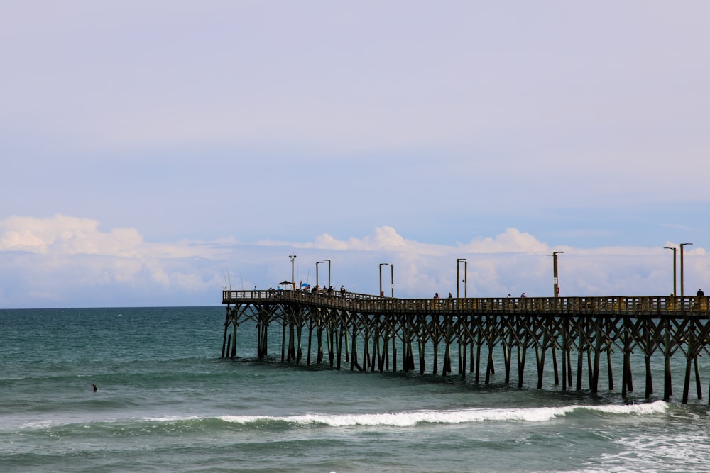 brown wooden dock on sea during daytime