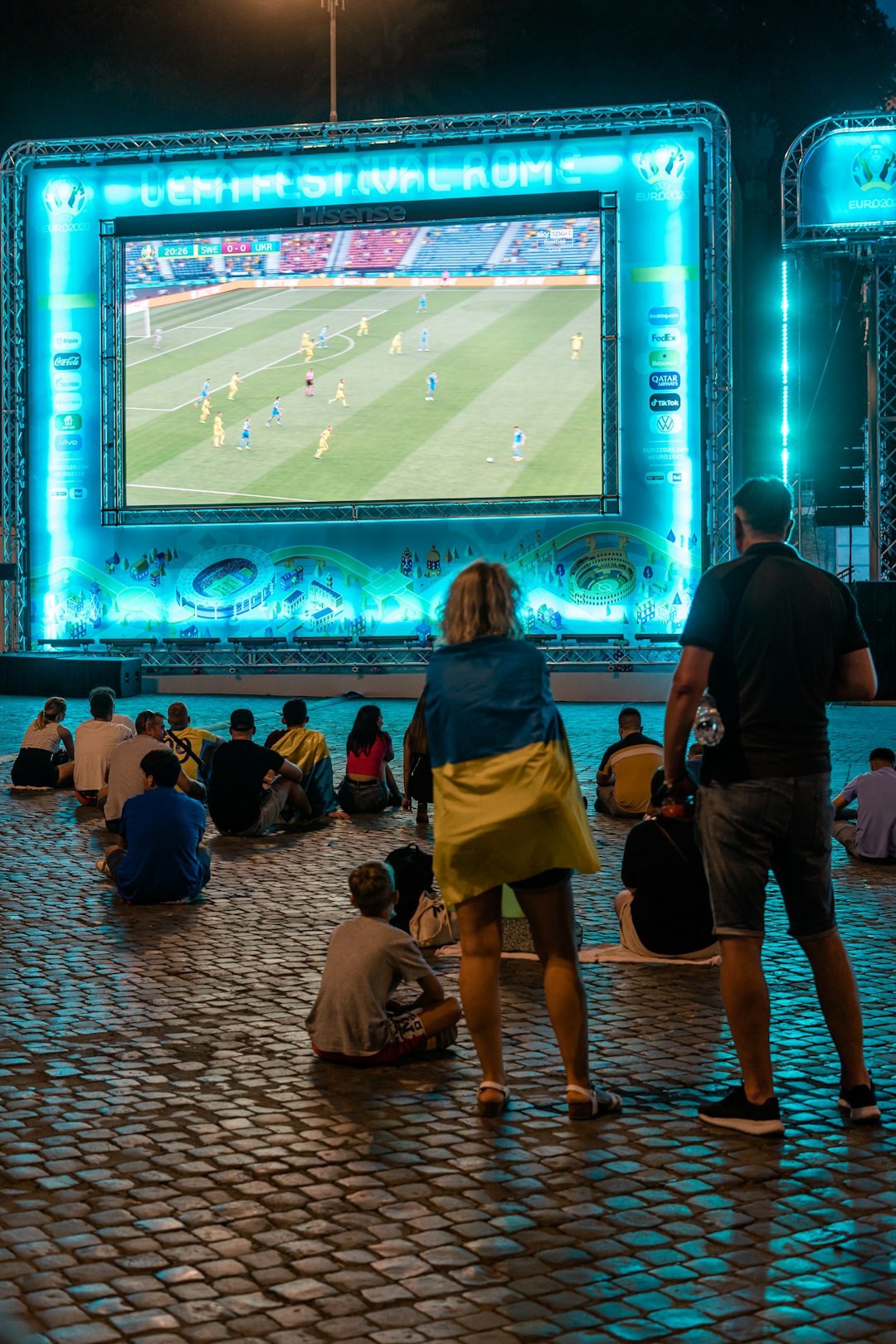 people sitting on chair watching soccer game