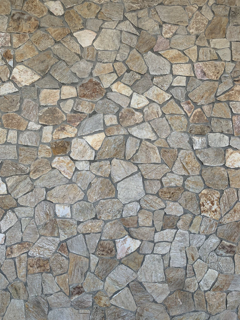 Ornamental granite from Upper Quarry — silver, copper and black with pink feldspar