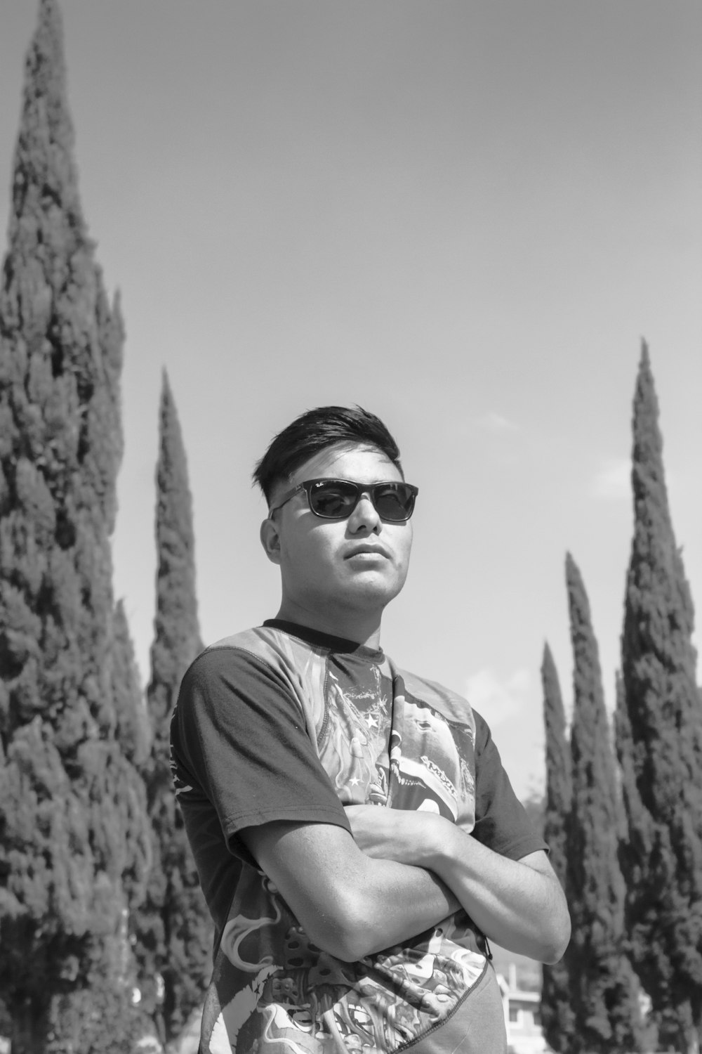 grayscale photo of man wearing sunglasses and crew neck t-shirt