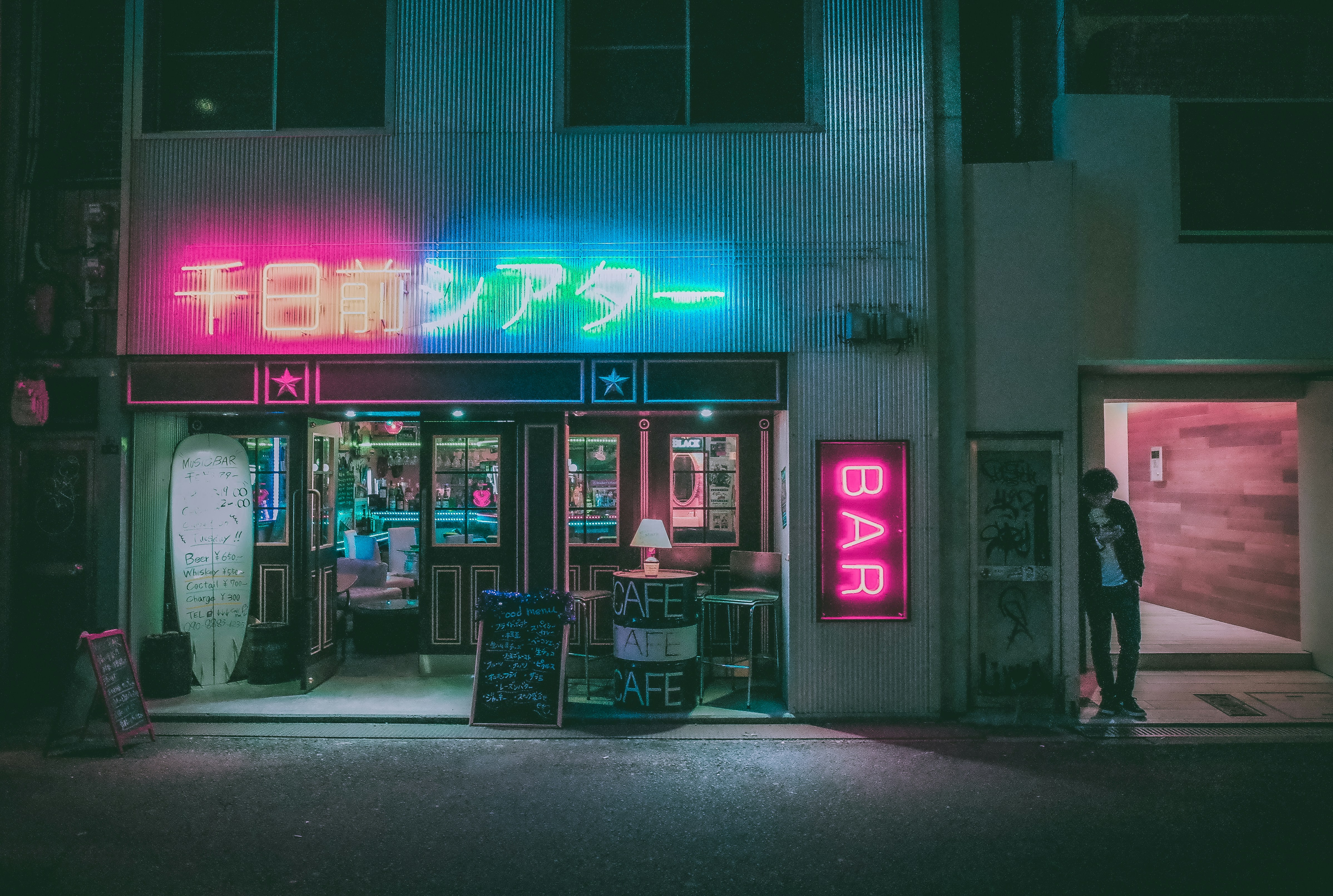 black steel bench in front of store during night time