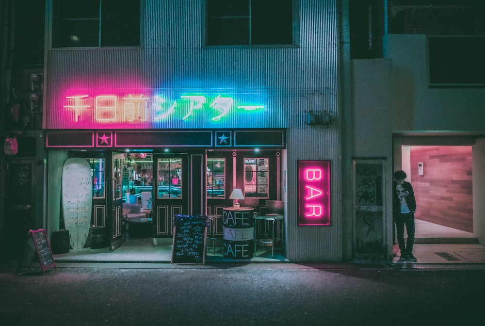 black steel bench in front of store during night time