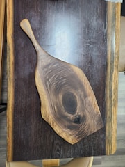 Rustic wooden cutting boards featuring unique grain textures from repurposed hardwood.