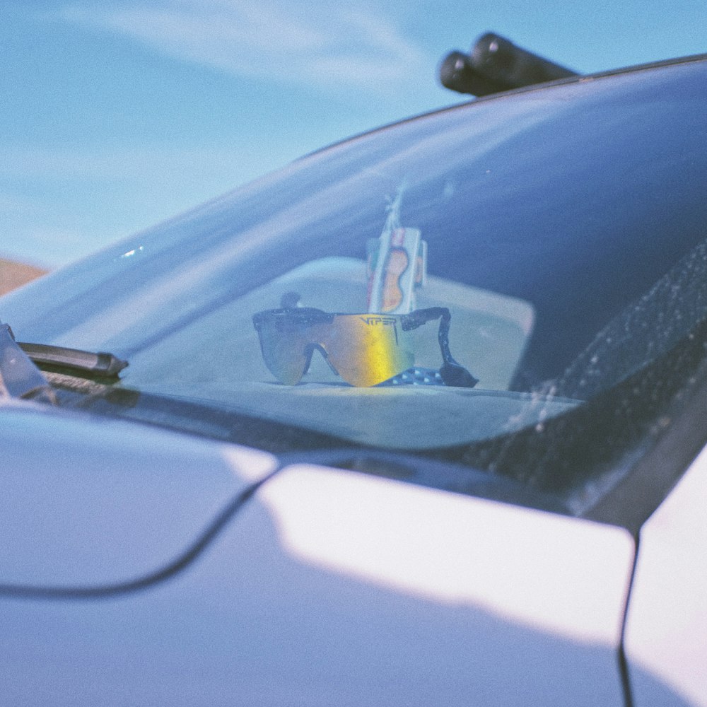 yellow and white plastic toy on car