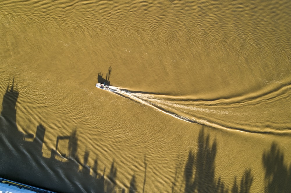 white boat on body of water during daytime