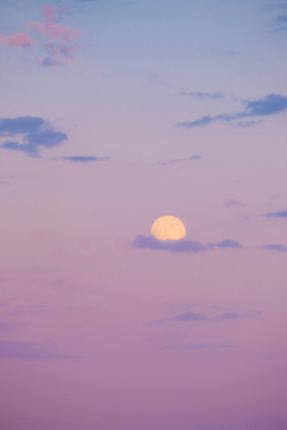 full moon over the clouds