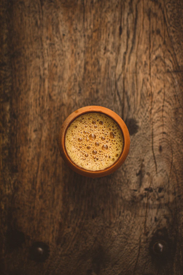 Brown clay container on wooden table