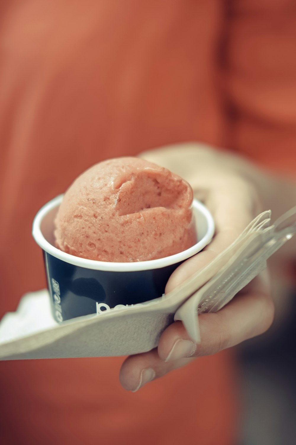 person holding ice cream cone