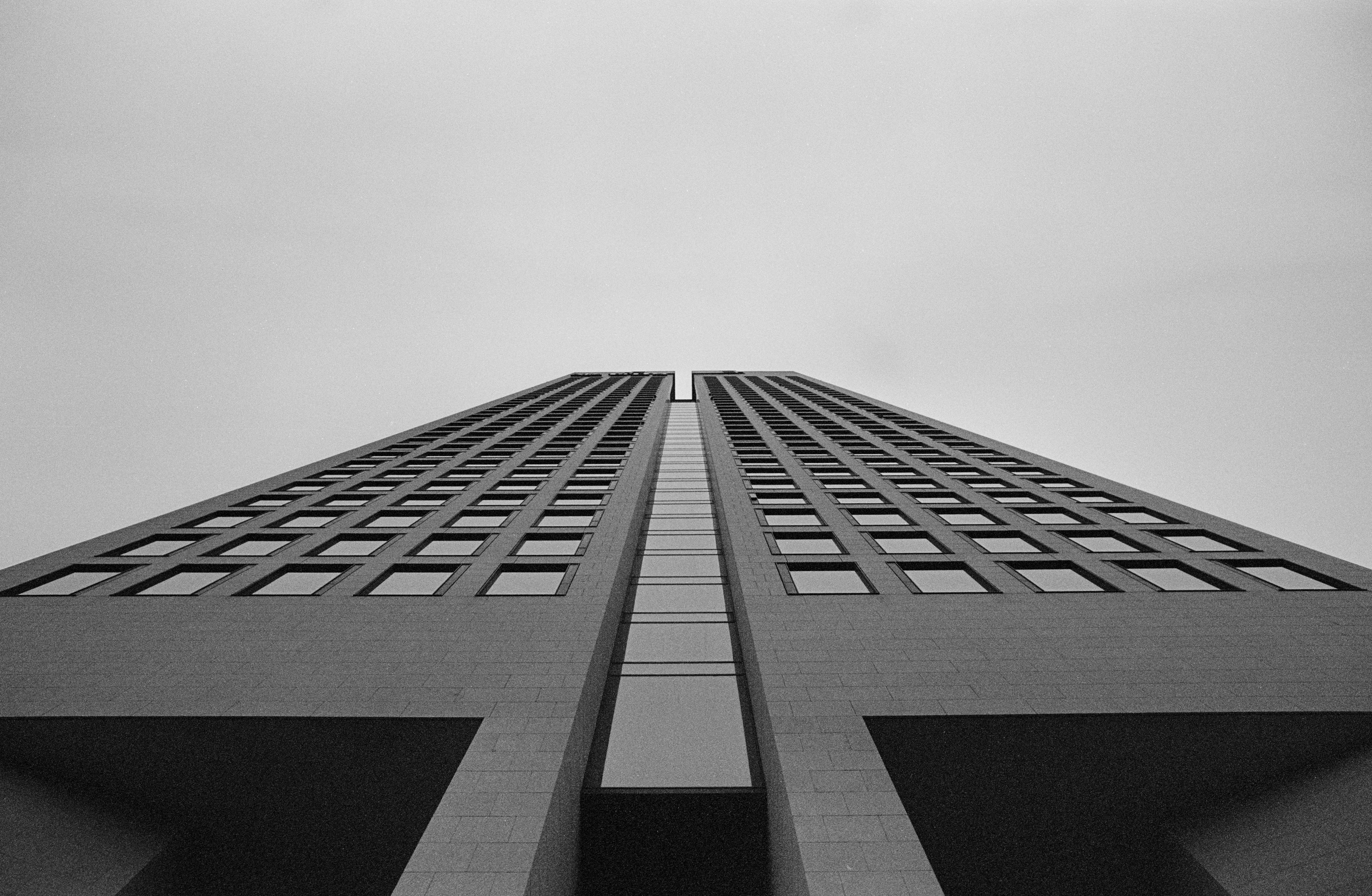 Skyscraper - urban architecture storefront - finance district Frankfurt am Main. Leica R7 (1994), Elmarit-R 2.8 28mm (1977). Hi-Res analog scan by: www.totallyinfocus.com - Kodak BW 400CN (expired 2004)