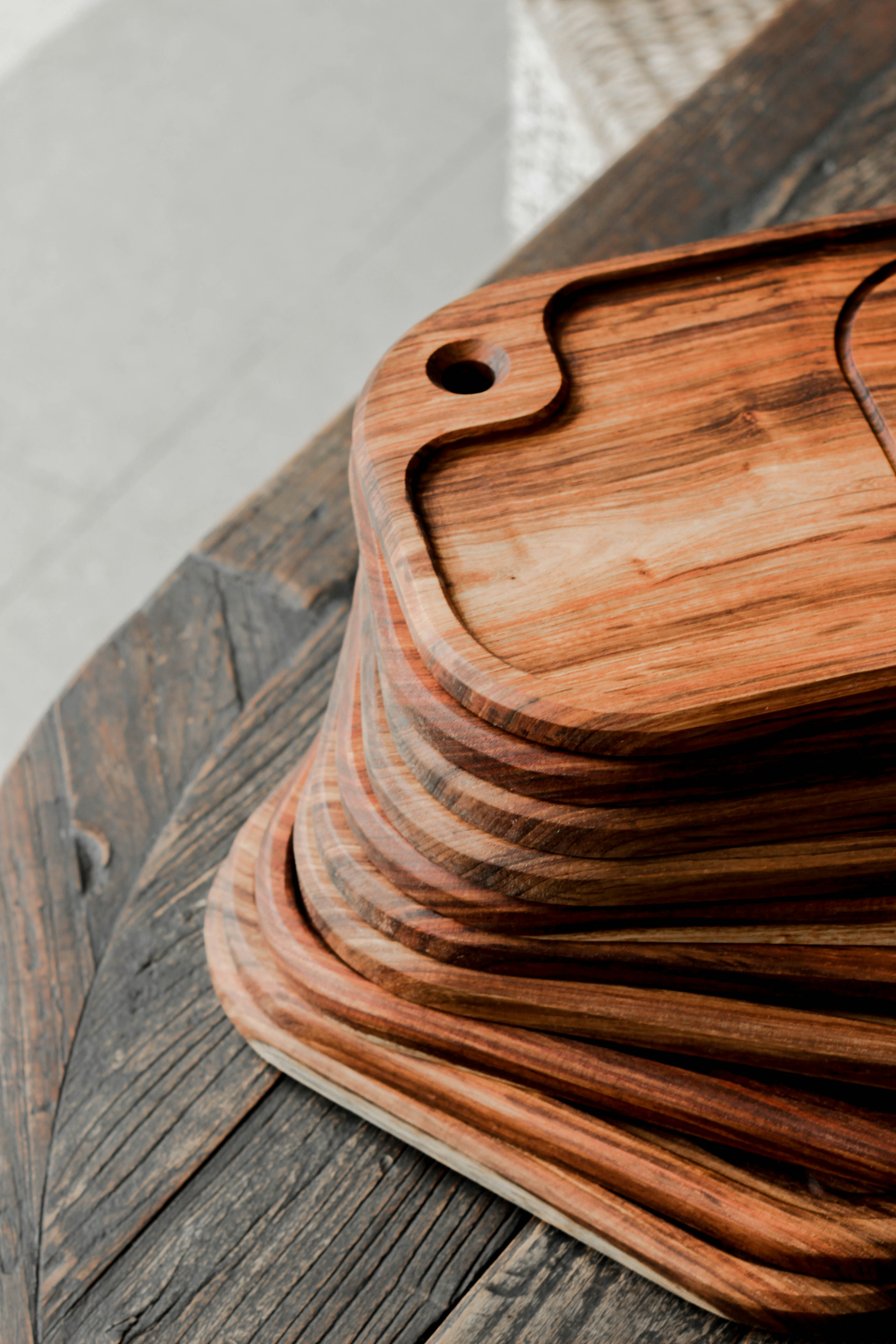 brown wooden chopping board on brown wooden table