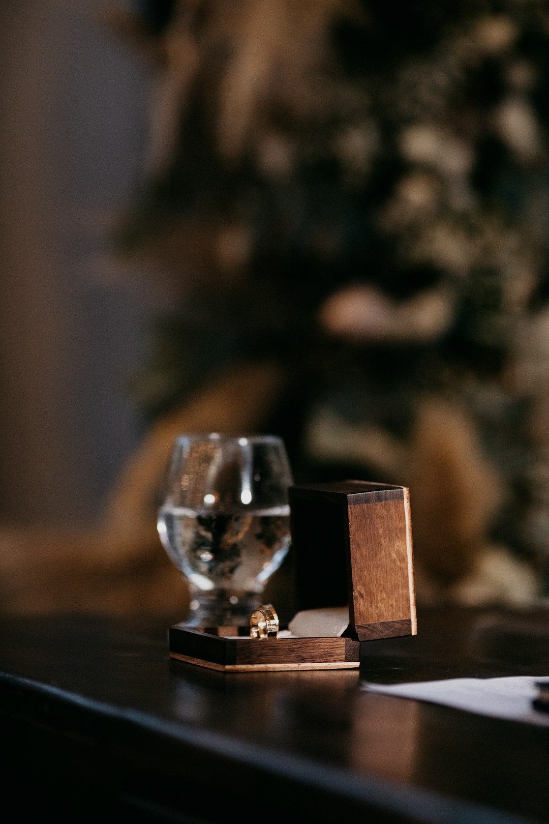 clear glass candle holder on brown wooden table