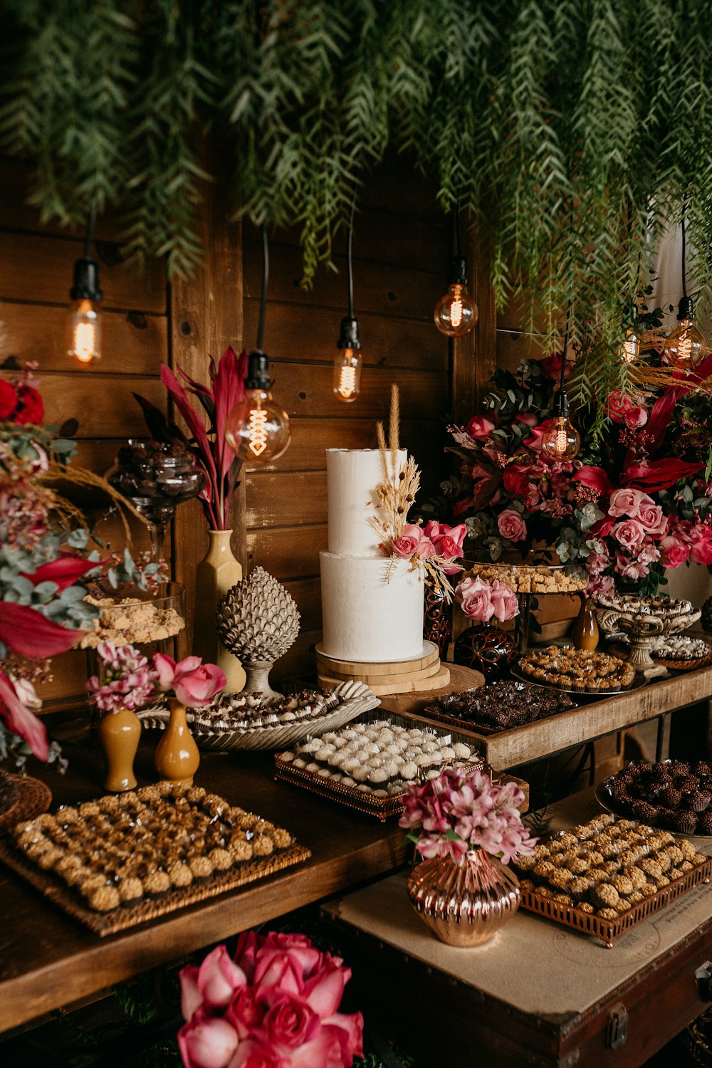 white and brown cake with candles on brown wooden table