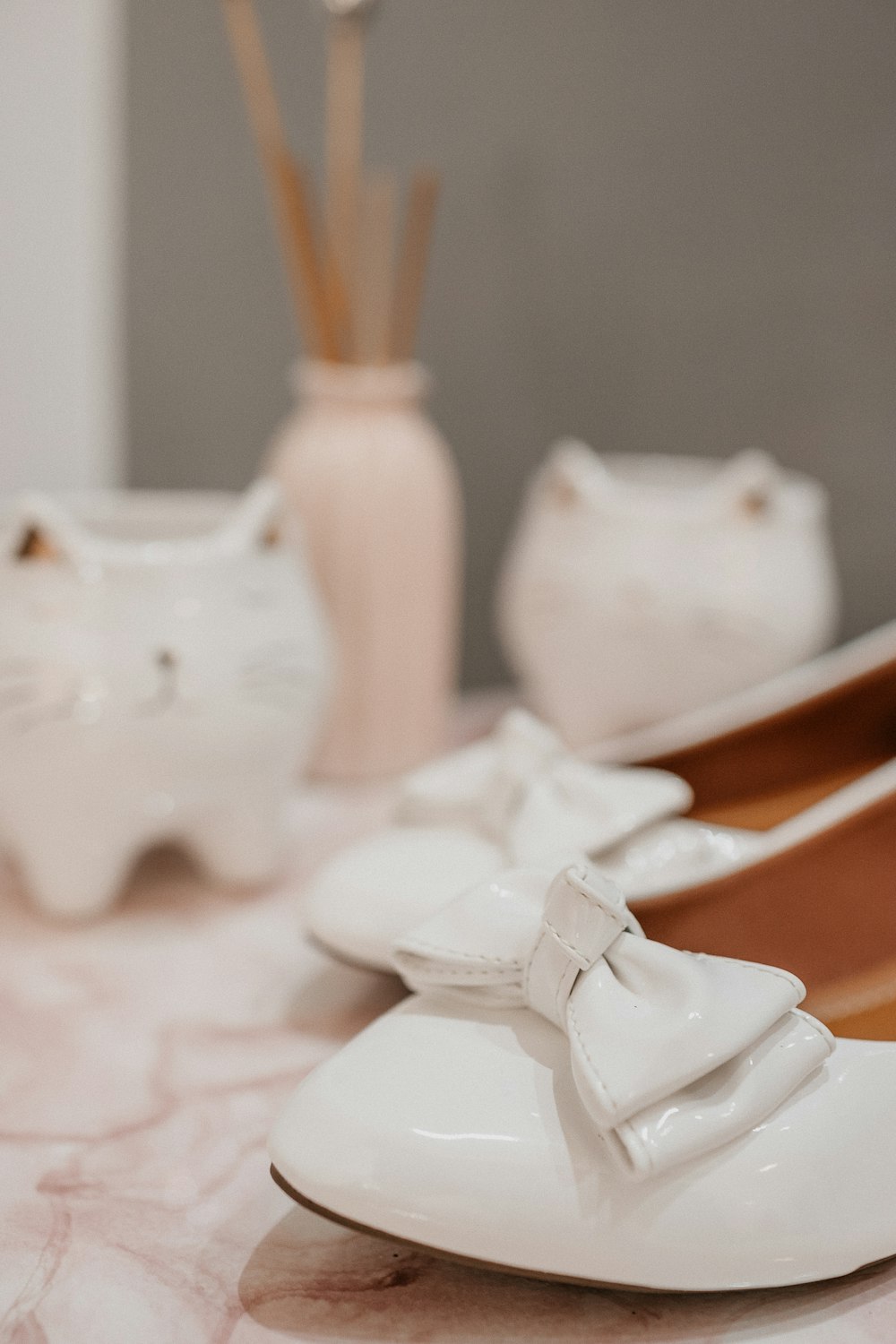 white ceramic figurine on white textile