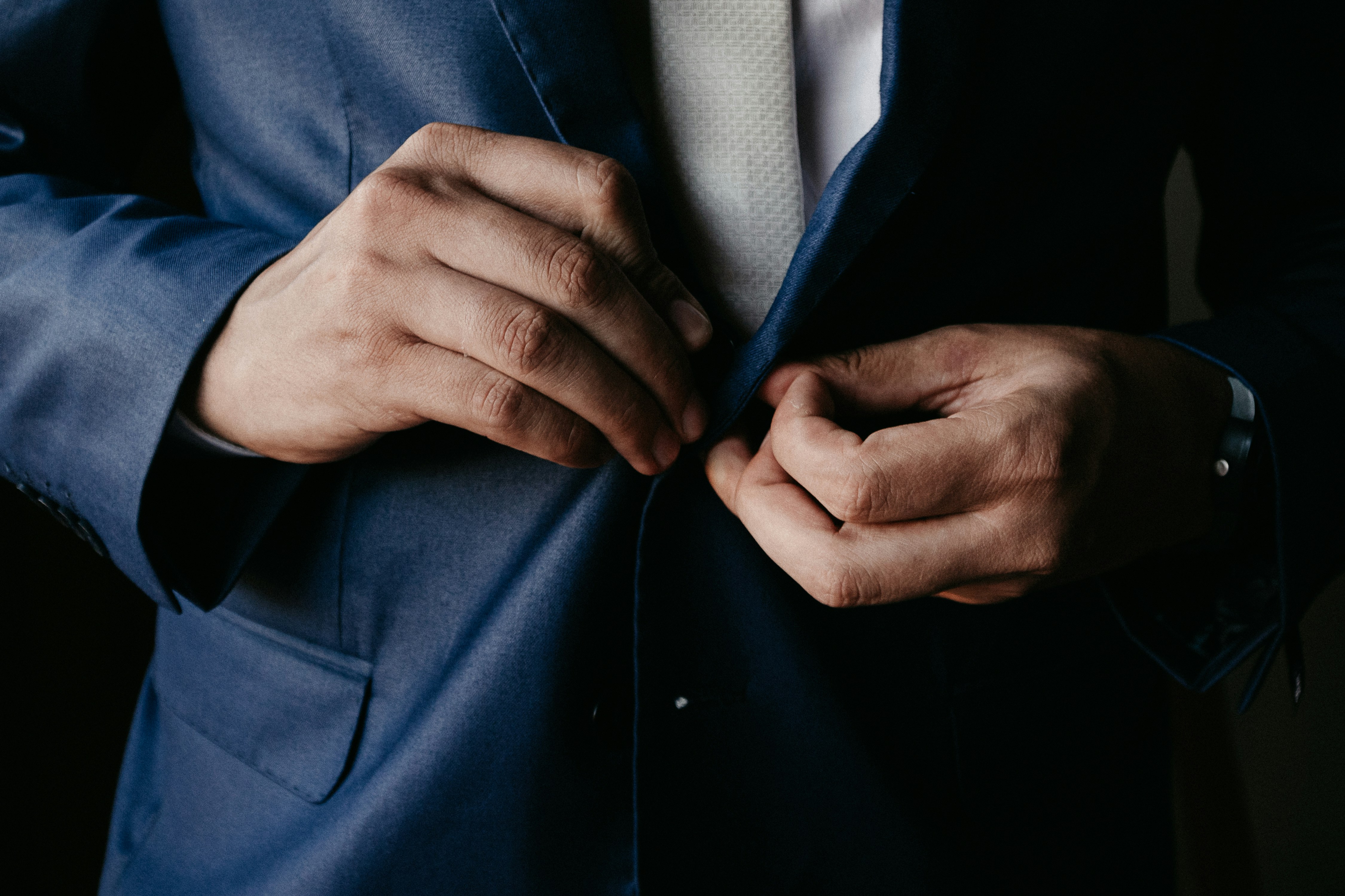 man in blue suit jacket