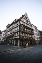 View of the historic Fachwerkhaus exterior in the heart of Quedlinburg's UNESCO site.