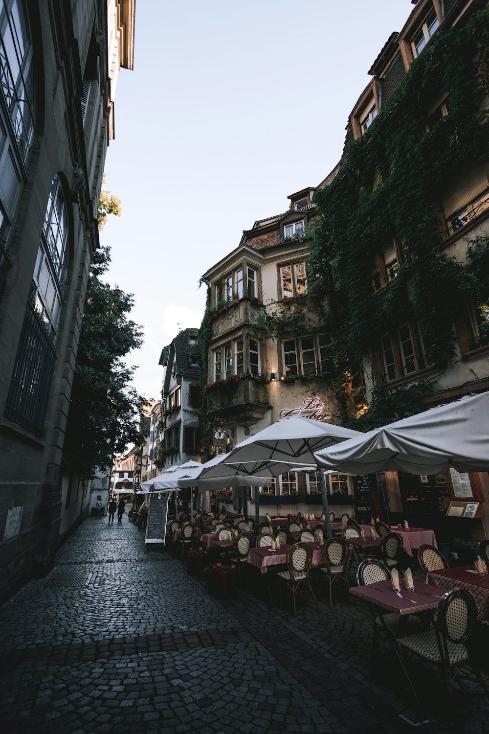 people sitting on chairs near building during daytime