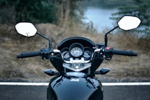 black and white motorcycle on road during daytime