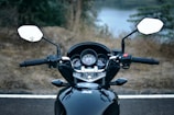 black and white motorcycle on road during daytime