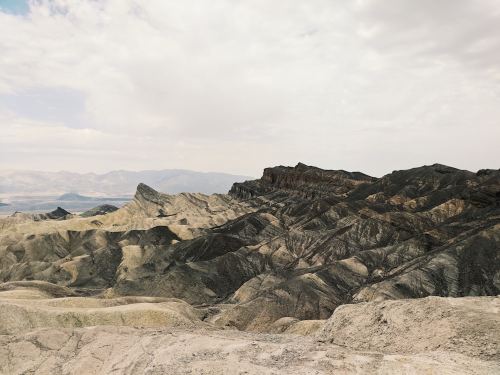 brown rocky mountain under white cloudy sky during daytime