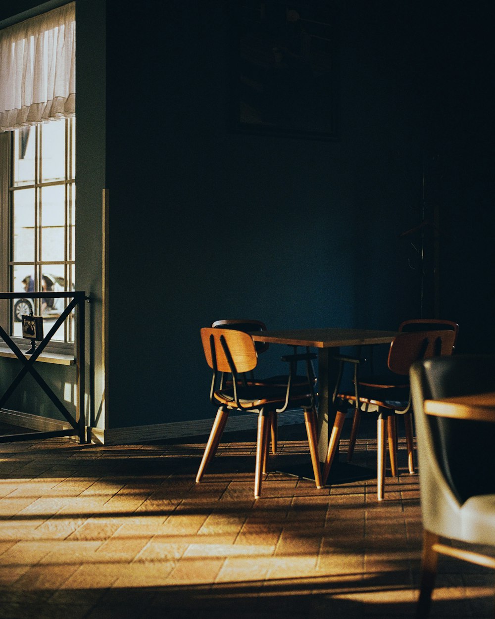 brown wooden chairs and table