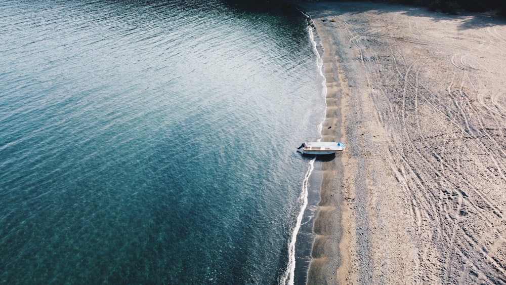 aerial view of white boat on sea during daytime