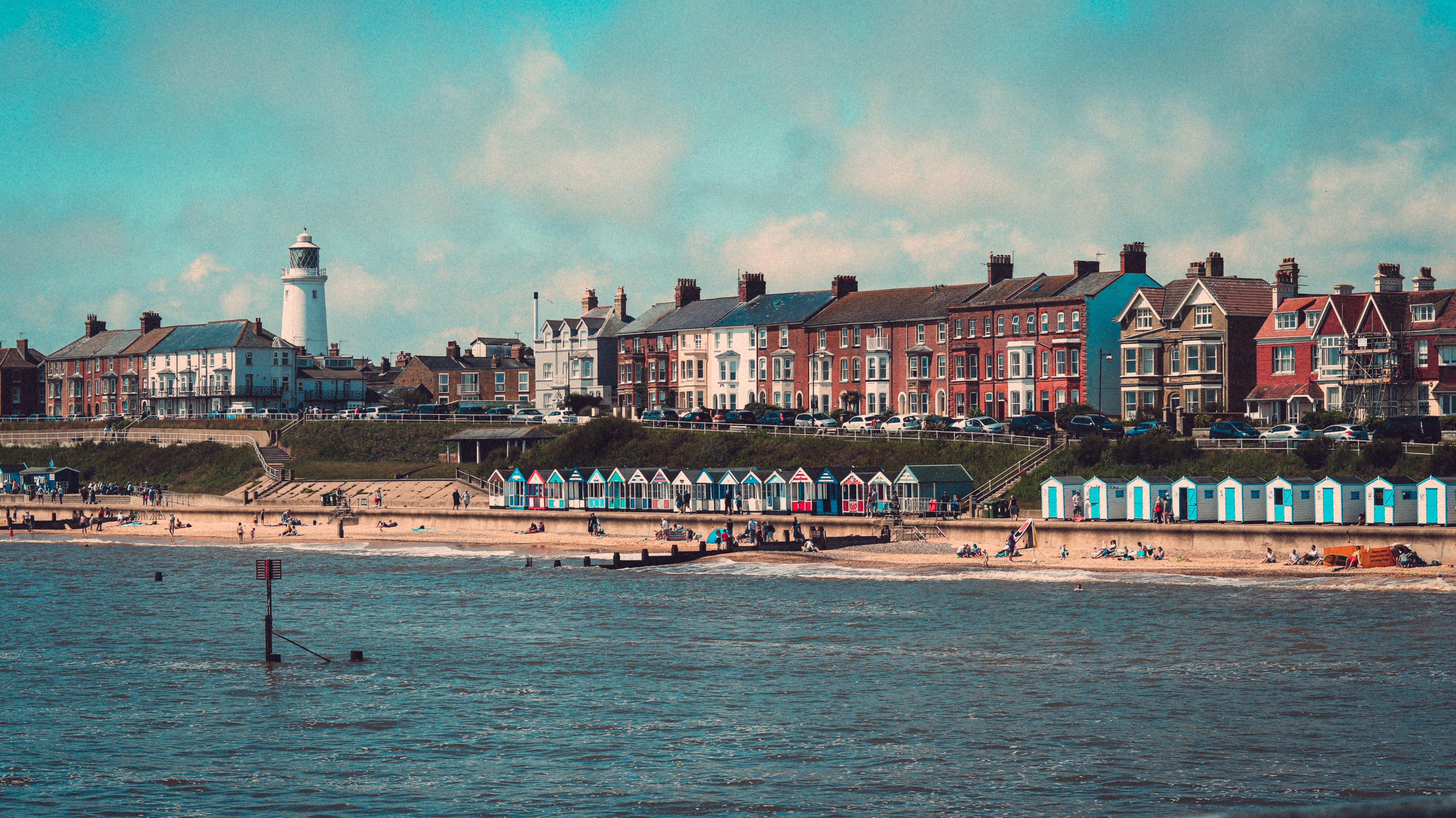 brown and white concrete building near body of water during daytime