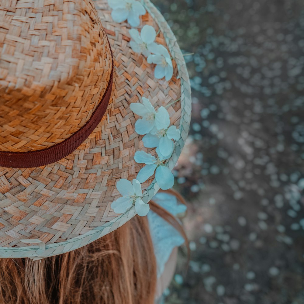 woman in brown and white sun hat