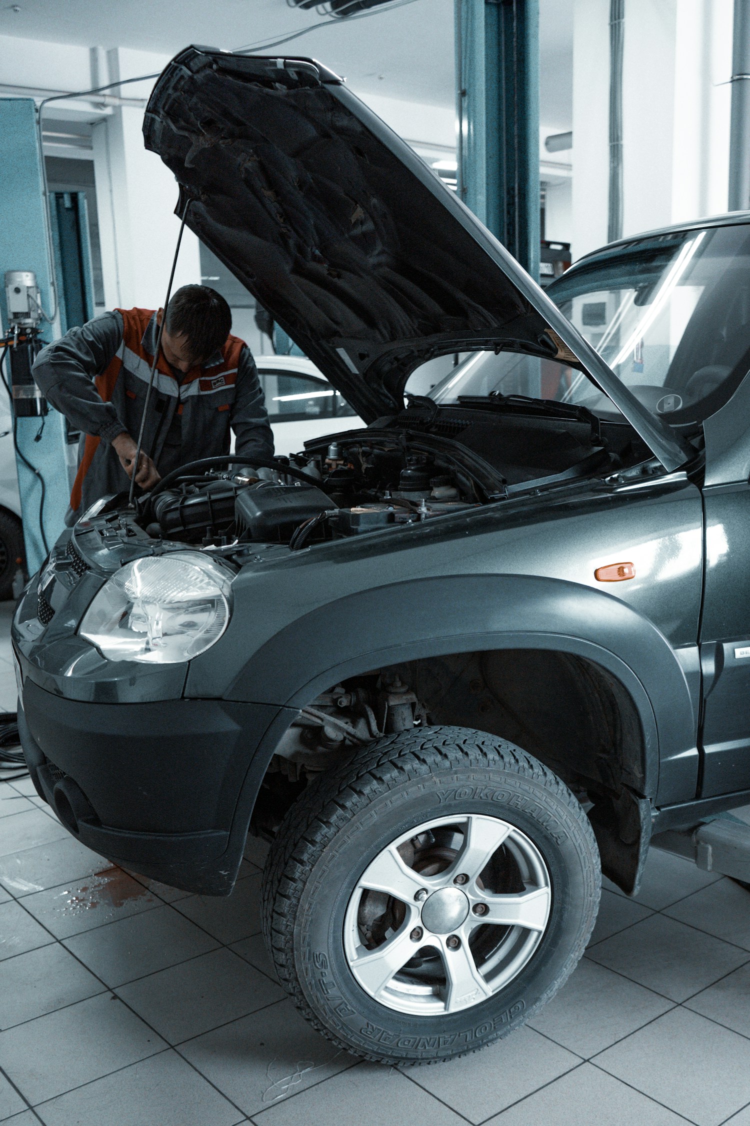 Image of our skilled mechanics working on a car