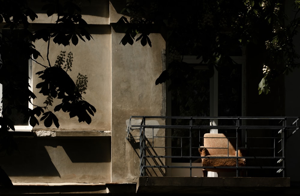 brown wooden chair on gray concrete staircase