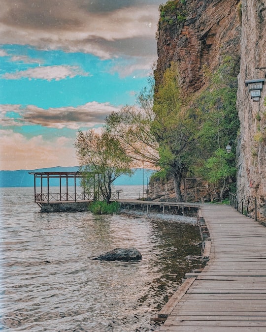 brown wooden dock near body of water during daytime in Ohrid North Macedonia