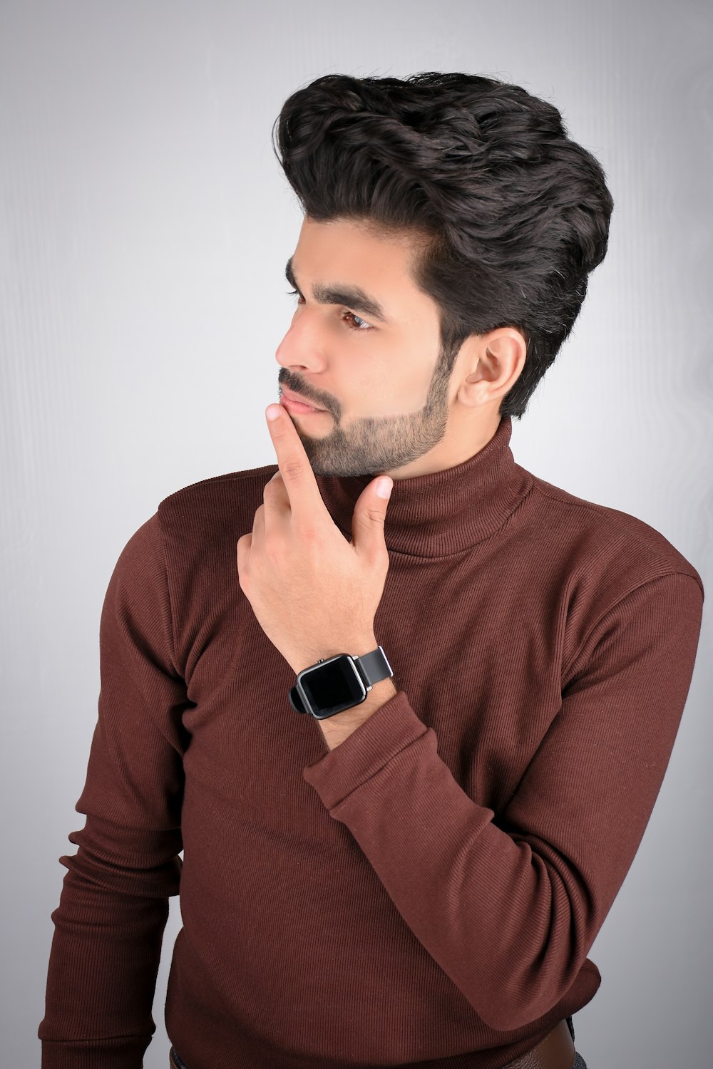 man in red crew neck long sleeve shirt wearing black and silver watch