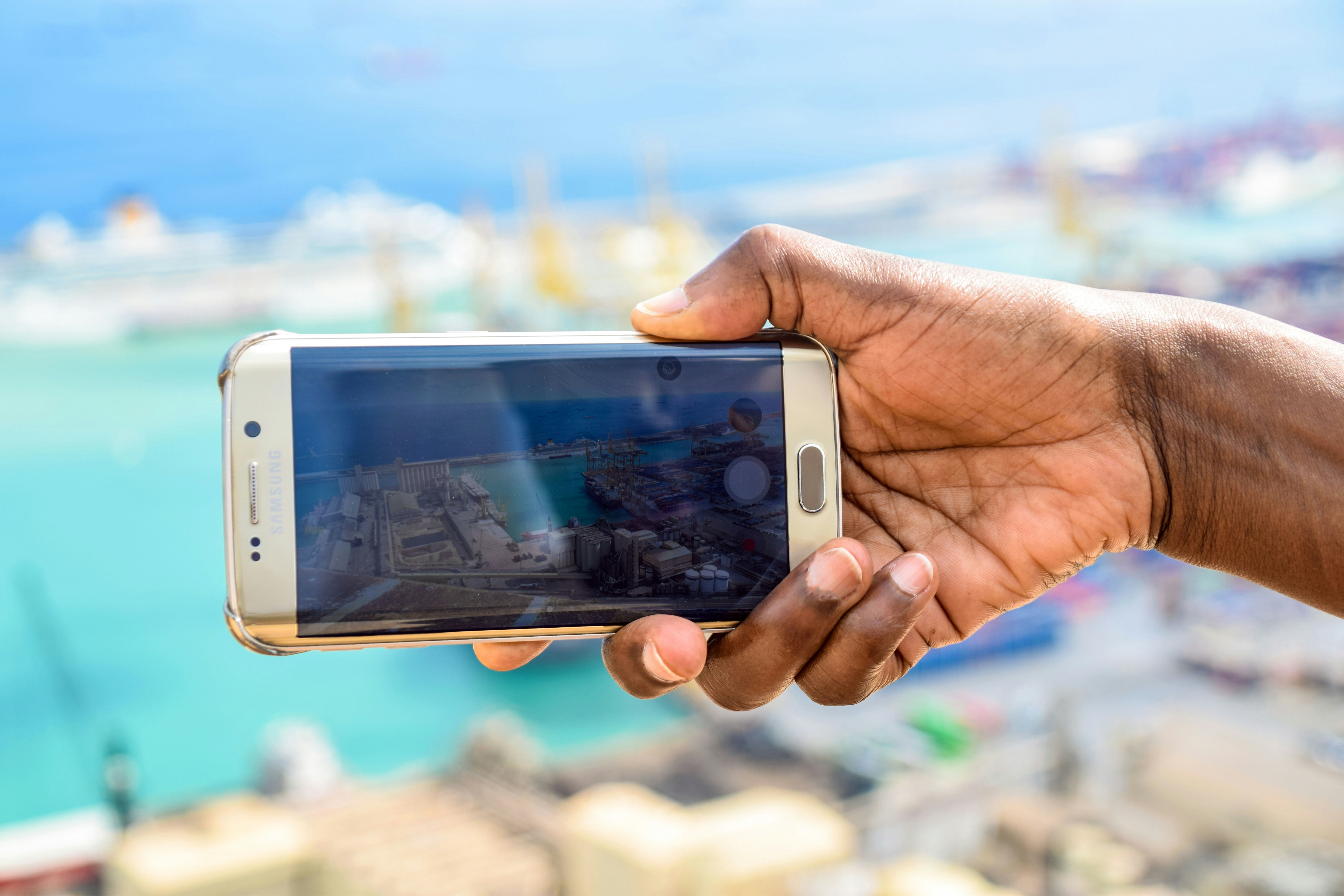 person holding silver iphone 6